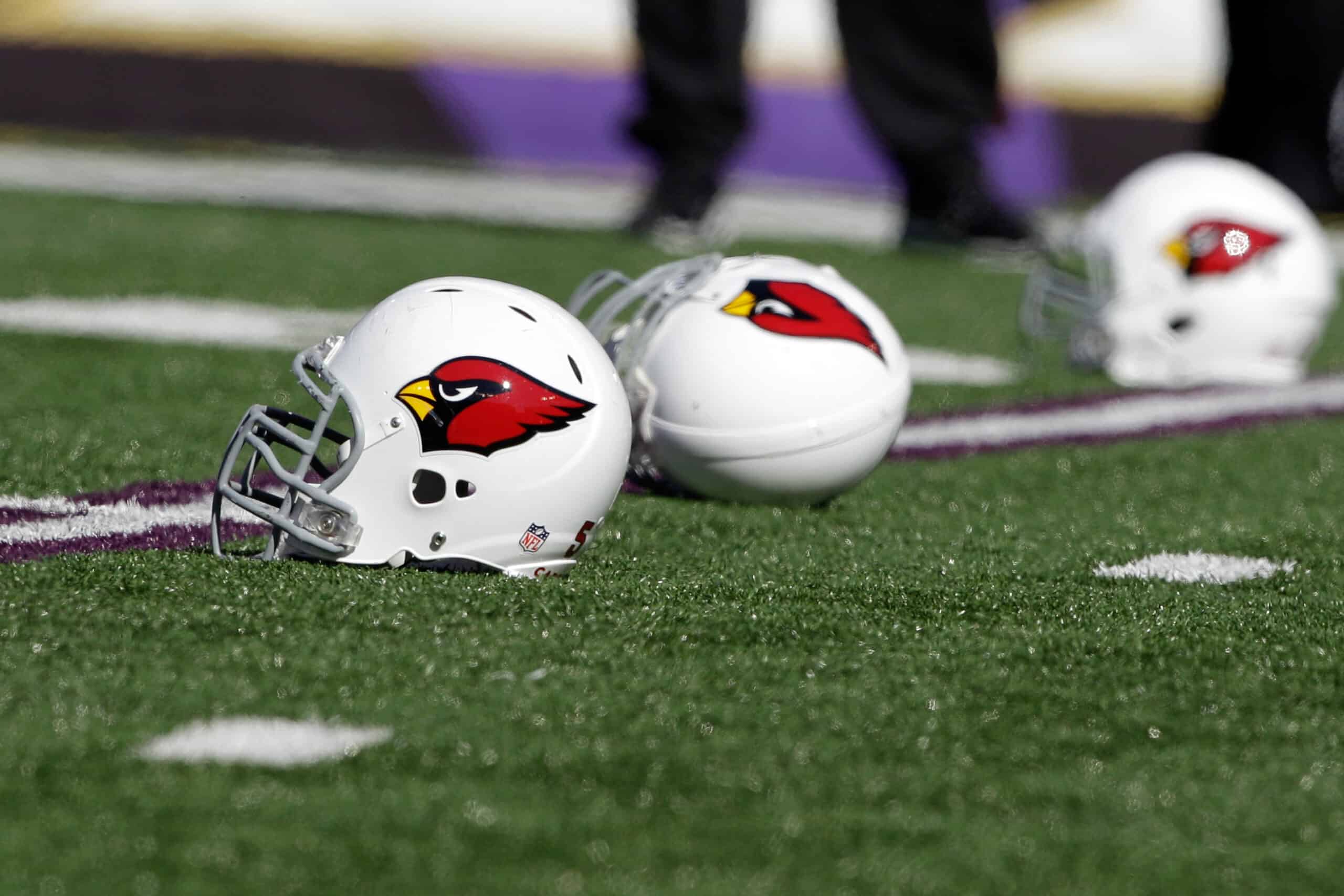 Helmets belonging to the Arizona Cardinals sit on the turf before the start of the Cardinals game against the Baltimore Ravens at M&T Bank Stadium on October 30, 2011 in Baltimore, Maryland.