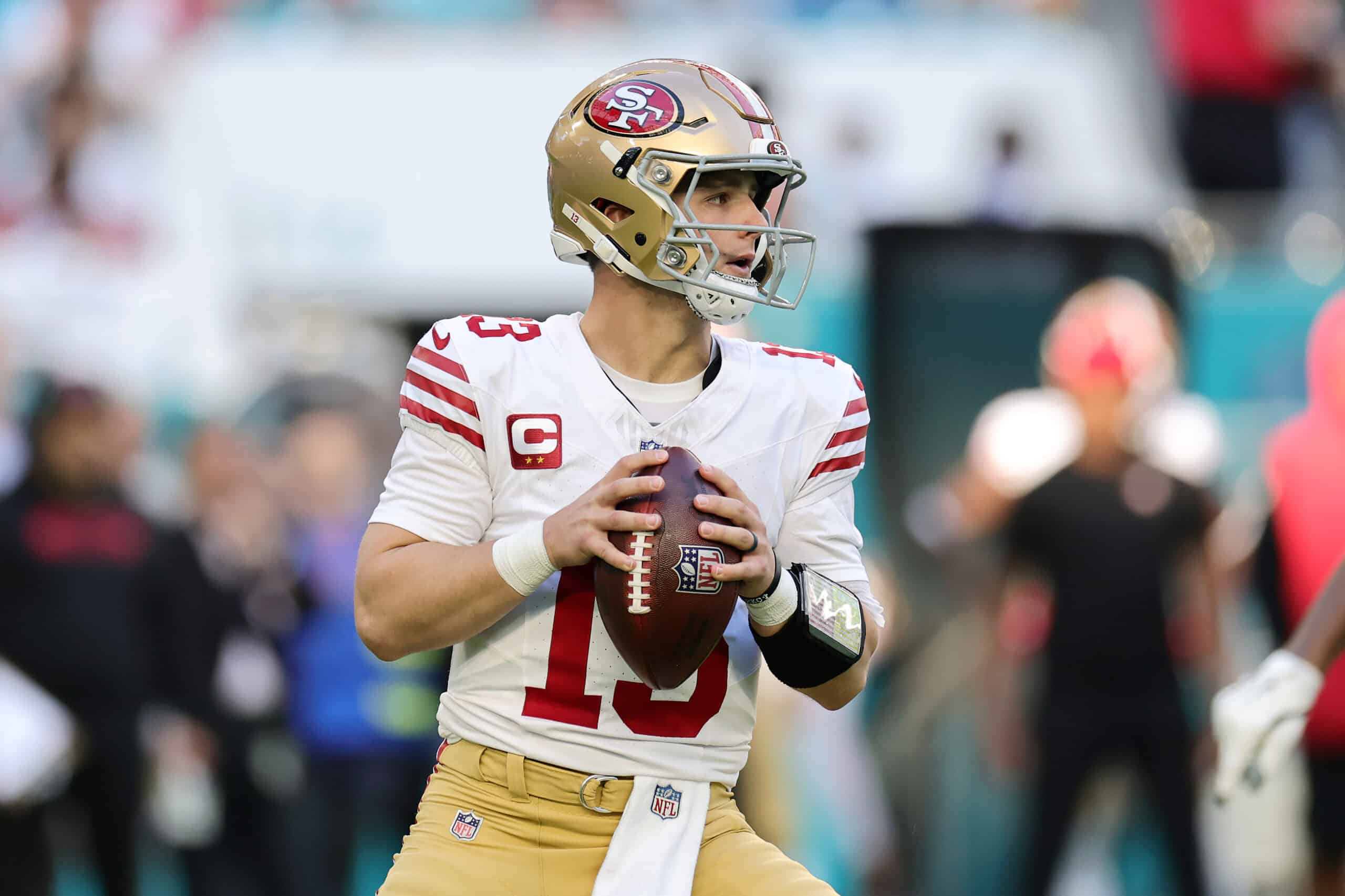 MIAMI GARDENS, FLORIDA - DECEMBER 22: Brock Purdy #13 of the San Francisco 49ers looks to throw a pass during the first quarter against the Miami Dolphins at Hard Rock Stadium on December 22, 2024 in Miami Gardens, Florida.