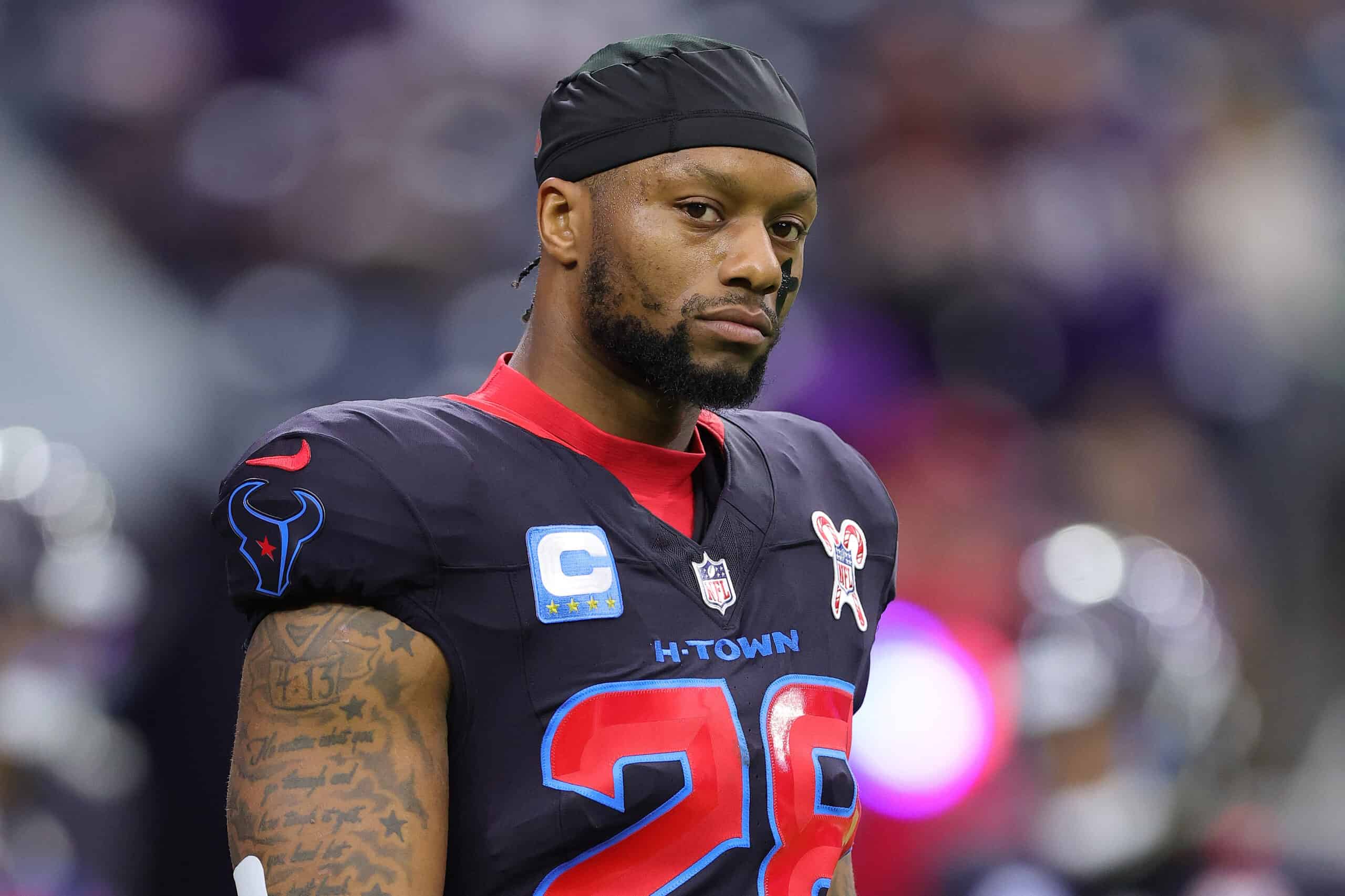 HOUSTON, TEXAS - DECEMBER 25: Joe Mixon #28 of the Houston Texans warms up prior to the game against the Baltimore Ravens at NRG Stadium on December 25, 2024 in Houston, Texas.