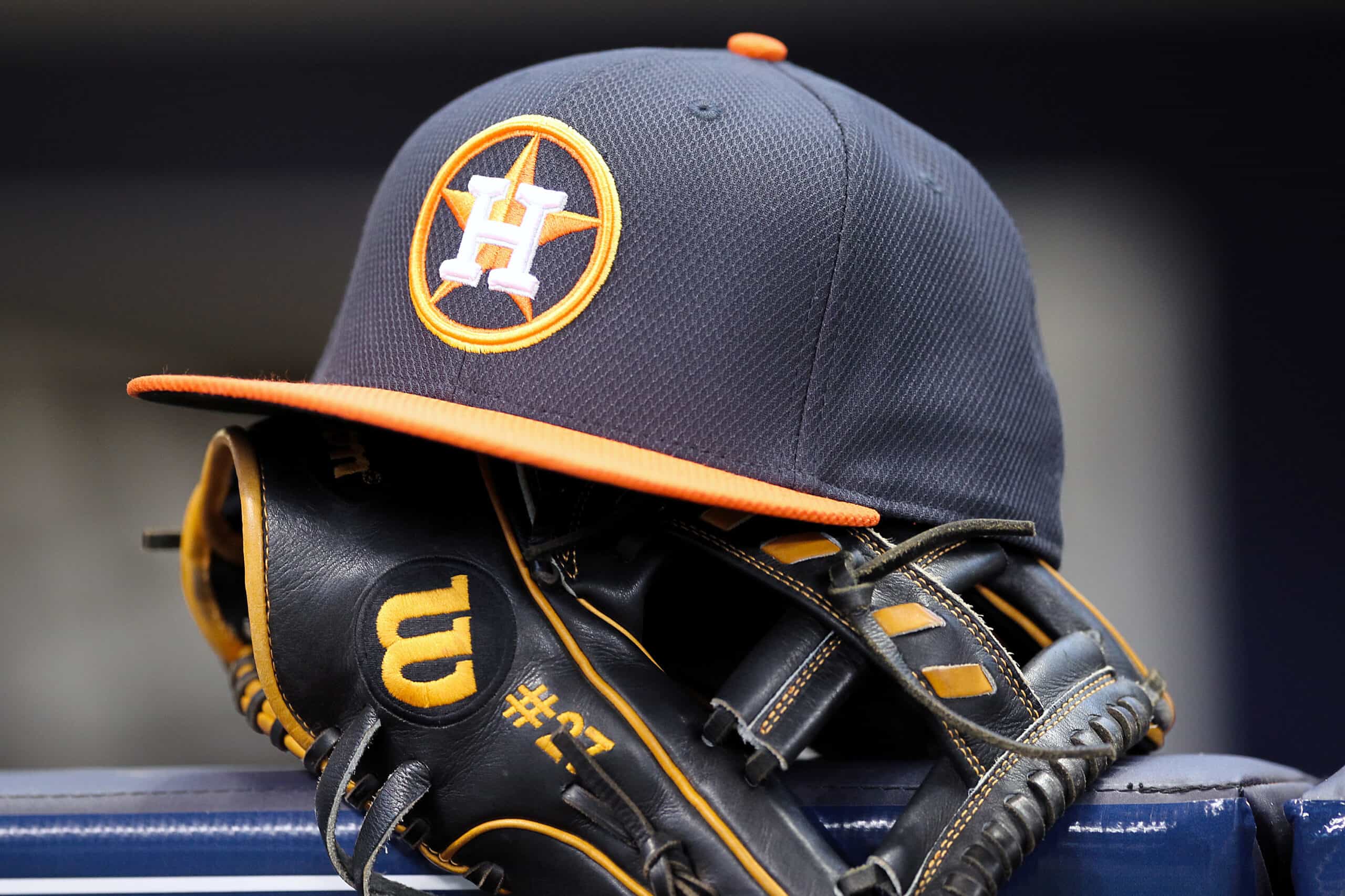 MILWAUKEE, WISCONSIN - APRIL 10: Jose Altuve #27 of Houston Astros rests his hat and glove in the dugout before the game against the Milwaukee Brewers at Miller Park on April 10, 2016 in Milwaukee, Wisconsin.