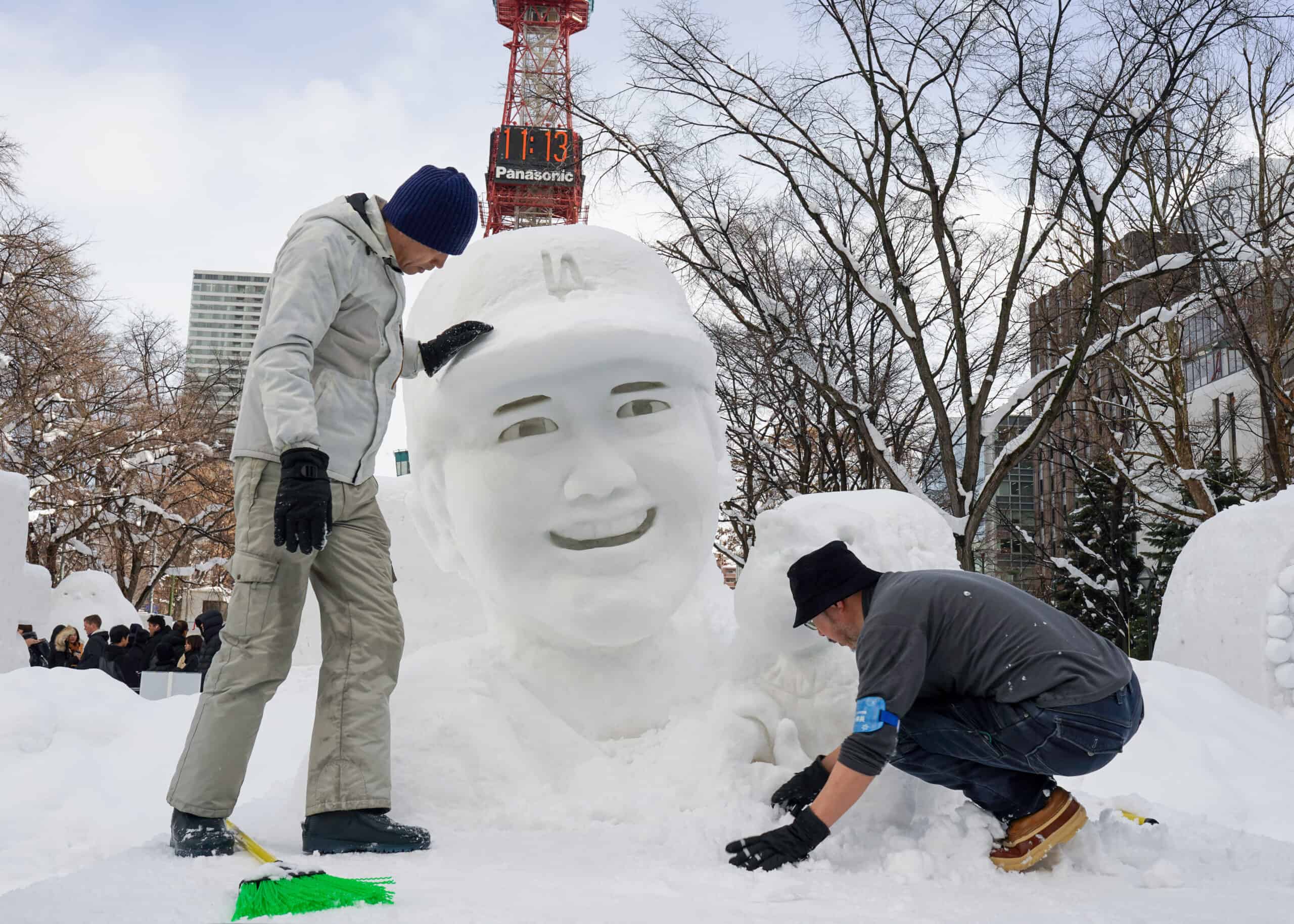 SAPPORO, JAPAN - FEBRUARY 04: Workers touch up a snow sculpture of Japanese baseball player Shohei Ohtani during the 75th Sapporo Snow Festival on February 04, 2025 in Sapporo, Japan. The Sapporo Snow Festival, held annually in early February, is one of Japan's most iconic winter events, attracting over two million visitors to marvel at its stunning snow and ice sculptures across three main venues: Odori Park, Susukino, and Tsudome. The festival, which began in 1950 with six snow sculptures created by local students, has grown into a global spectacle featuring large-scale snow art, illuminated displays, and various winter activities.