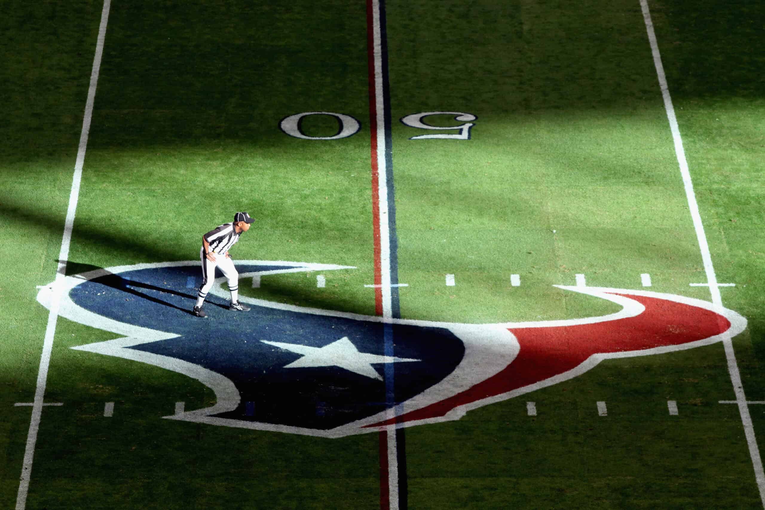 HOUSTON, TX - JANUARY 07: A referee is seen standing on a Houston Texans logo while the Texans host the Cincinnati Bengals during their 2012 AFC Wild Card Playoff game at Reliant Stadium on January 7, 2012 in Houston, Texas.