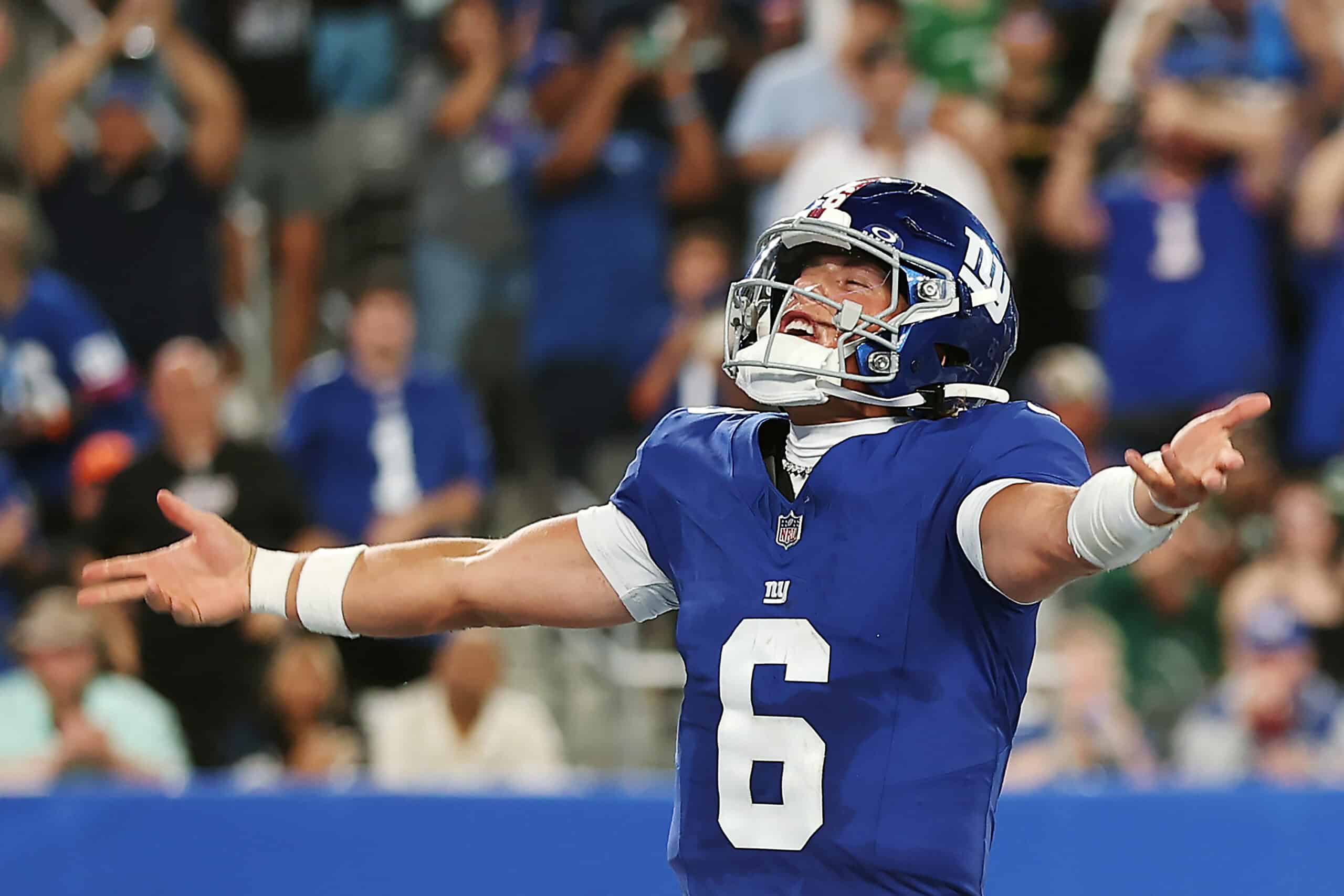 EAST RUTHERFORD, NEW JERSEY - AUGUST 16: Jaxson Dart #6 of the New York Giants reacts after throwing a touchdown pass during the second half of the NFL Preseason 2025 game between New York Jets and New York Giants at MetLife Stadium on August 16, 2025 in East Rutherford, New Jersey. The Giants won 31-12.