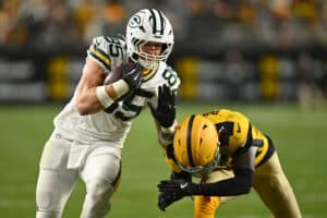 PITTSBURGH, PENNSYLVANIA - OCTOBER 26: Tucker Kraft #85 of the Green Bay Packers catches a pass for a first down against Joey Porter Jr. #24 of the Pittsburgh Steelers during the third quarter in the game at Acrisure Stadium on October 26, 2025 in Pittsburgh, Pennsylvania.