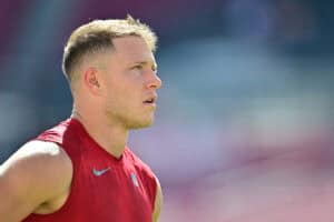 TAMPA, FLORIDA - OCTOBER 12: Christian McCaffrey #23 of the San Francisco 49ers looks on before the game against the Tampa Bay Buccaneers at Raymond James Stadium on October 12, 2025 in Tampa, Florida.