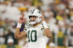 GREEN BAY, WISCONSIN - SEPTEMBER 11: Jordan Love #10 of the Green Bay Packers calls a play against the Washington Commanders at Lambeau Field on September 11, 2025 in Green Bay, Wisconsin.