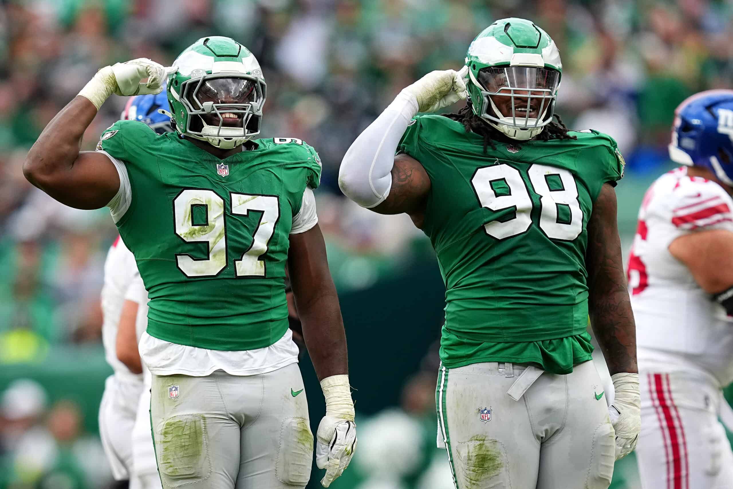 PHILADELPHIA, PENNSYLVANIA - OCTOBER 26: Moro Ojomo #97 and Jalen Carter #98 of the Philadelphia Eagles celebrate after a sack against the New York Giants during the fourth quarter in the game at Lincoln Financial Field on October 26, 2025 in Philadelphia, Pennsylvania.