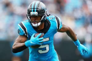 CHARLOTTE, NORTH CAROLINA - OCTOBER 12: Rico Dowdle #5 of the Carolina Panthers runs for a touchdown during the third quarter against the Dallas Cowboys in the game at Bank of America Stadium on October 12, 2025 in Charlotte, North Carolina.