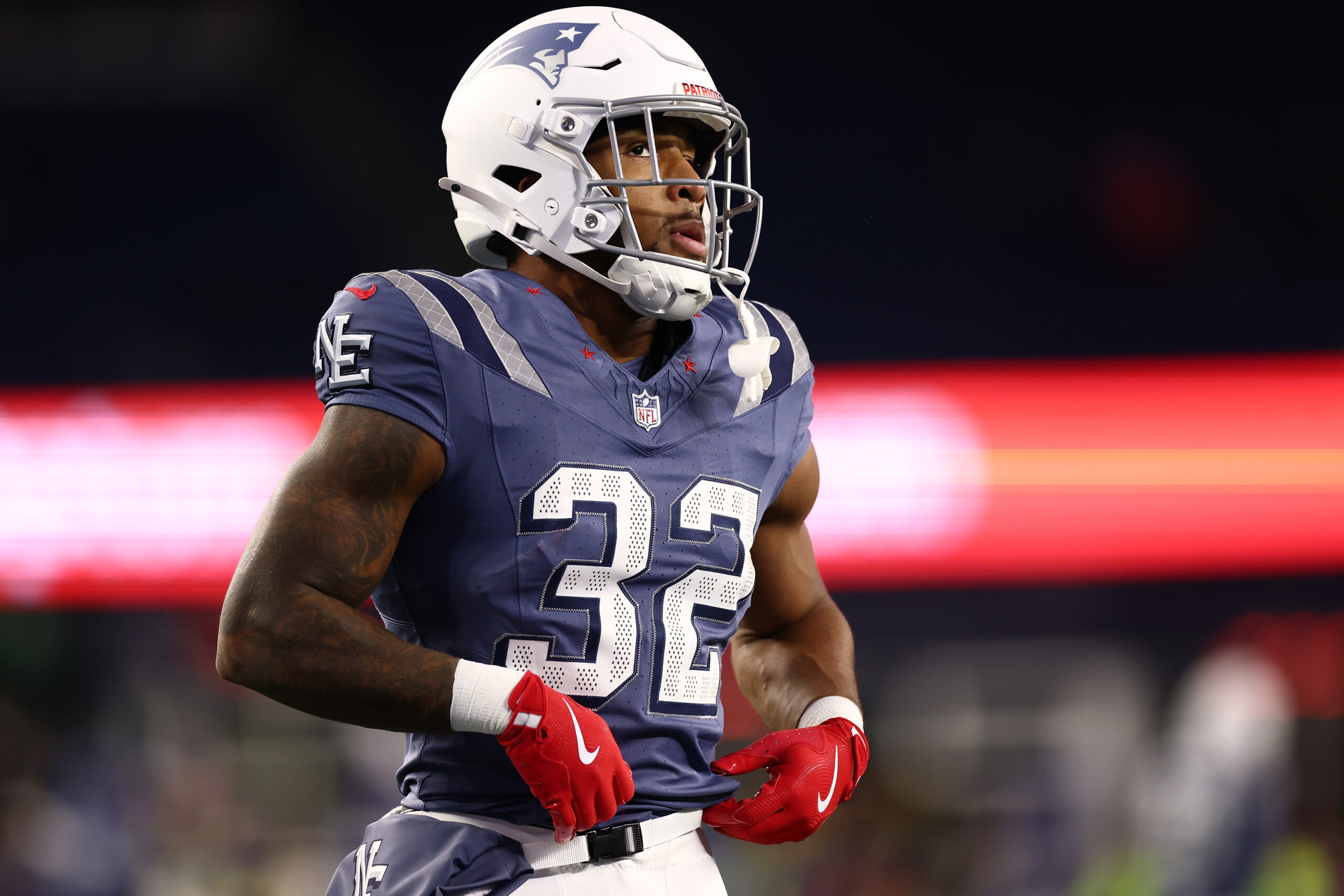 FOXBOROUGH, MASSACHUSETTS - NOVEMBER 13: TreVeyon Henderson #32 of the New England Patriots participates in warmups prior to a game against the New York Jets at Gillette Stadium on November 13, 2025 in Foxborough, Massachusetts. 